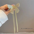 Detail of golden butterfly hair claw with tassel fringe and sparkling rhinestones - Gold Full Diamond Bow Tassel Claw Clip
