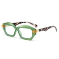 Modern green geometric sunglasses with tortoiseshell temples and orange accents shown in profile - Green Frame
