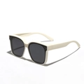 Retro cream square polarized sunglasses with dark grey lenses in 45-degree side view - Matte Cream
