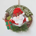 Ghirlanda di Natale con Babbo Natale in peluche e striscione HO HO HO su anello di pino - Sacco dei Regali Babbo Natale