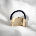 Minimalist elastic hair tie featuring a polished gold metallic plate on black cord - Gold Curved Bar
