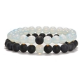 Detailed view of 8mm natural stone stretch bracelets in matte black and opal white beads - Opalite + Matte Black Agate