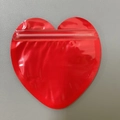 Bright red heart-shaped PVC pouch with secure resealable zip lock for jewelry gifts - Red