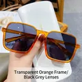 Gafas de sol cuadradas con montura naranja translúcida y lentes grises negras - Montura Naranja Translúcida Lente Gris Negro