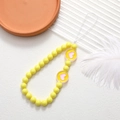 Beaded wrist strap for phones featuring yellow beads and pink heart charms on white cord - Two Hearts (K2941)
