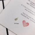 Macro detail of a 6x4mm mini rhinestone pendant with gold-plated setting and dual loops - 4mm Single Loop 14K Gold