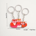 Detail of wooden fox family keychain set showing dimensions 9cm by 10cm and 17g weight - Fox Family of Three