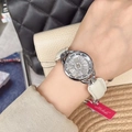 Elegant ladies watch with rhinestone flower dial and beige leather strap on wrist - Silver