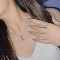Blue square gemstone necklace and ring set in silver finish on a female model - Tz-40 [white Diamond]