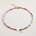 Colorful beaded necklace featuring golden letter A pendant and white shell heart charm - Letter A