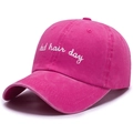Close-up of rose red washed cotton baseball cap with white Bad Hair Day embroidery - One Size / Rose Red