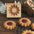 Rectangular beechwood cookie mold featuring floral carving with jam-filled biscuits - Sandwich Snowflake