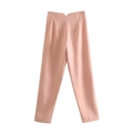 Detail view of pink high-waist casual trousers with classic center fold line and flat texture - XS / Orange Pink