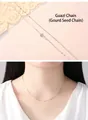 Elegant S925 sterling silver melon seed chain necklace shown on light pink background - White Gold Melon Seed Chain