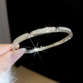 Close-up detail of silver-colored bracelet with pavé-set cubic zirconia stones - Silver-Modular Fine Tube (6#)