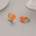 Golden hoop earrings featuring orange enamel smiley faces and sparkling clear zircon stones - Orange