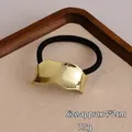 Minimalist elastic hair tie with wavy golden metal charm, 4x2cm size and 7.5g weight - Wide Surface Gold