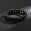 Detail of black stainless steel bike chain bracelet with industrial mechanical aesthetic - Black (KB123287-KFC)