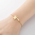 Elegant gold chain bracelet featuring a minimalist coconut tree charm on female wrist - 353-Coconut Tree