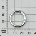Silver metal spring ring clasp on grid paper showing 25mm outer diameter size - 25mm Round Spring Ring / Bright Silver