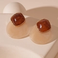 Close-up of vintage resin geometric earrings with brown square and apricot round pendants - Silver Needle - Brown Resin Geometric Studs