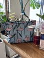 Blue canvas makeup bag with pink floral patterns and A GOGO ORIGINAL tag - Coreopsis Floral