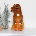 Detail of autumn gnome plush holding a pumpkin with Give Thanks embroidery - D2-33 Coffee Pumpkin Gnome