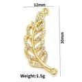 Detailed view of 18k gold leaf pendant with zircon inlay and 12mm x 30mm dimensions - Style 3-Gold Feather