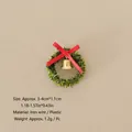 Mini Christmas wreath variant with green tinsel, golden bell, and red ribbon bow - No.76 - Christmas Wreath with Bow and Bell