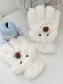 Close-up of white plush gloves featuring cute 3D cartoon animal designs and soft fur texture - White