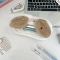 Detailed view of white plush stationery case with fluffy brown ears on a desk - Dog