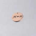 Macro detail of 20mm rose gold round cutout Mom pendant with heart shaped letter O - 20mm / Rose Gold