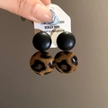 Detail of C-shaped leopard print earrings with fabric texture and price tag - 24# Silver Earring Post - Coffee Double Round Pendant
