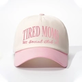 Close-up of pink TIRED MOMS embroidery on ivory and pink contrast baseball cap - One Size / Off-white and Pink