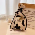 Knitted tote bag with black and white cow print featuring MILK CARTONS text design - Apricot Zebra Stripe