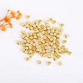 Macro view of 18K gold plated cube beads for DIY jewelry making with high metal luster - 2mm / Antique Gold