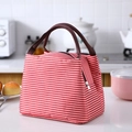 Insulated lunch bag with red and white horizontal stripes and dark brown handles - Red