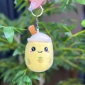 Detailed view of a yellow pineapple milk tea plush keychain with a metal ring - 11cm / Yellow Round Eye