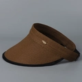 Detail of sun visor with straw weave texture and golden leaf emblem on a dark grey background - Coffee