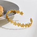 Golden daisy flower open bangle with hammered petal texture and vintage metallic finish - Gold Hollow Flower