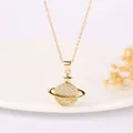 Close-up of golden Saturn planet pendant necklace with sparkling pavé zircons - Pave White Zirconia Planet Style