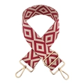 Macro detail of red and white geometric diamond woven bag strap with gold metal hooks - Beige and Wine Red