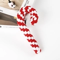 Detail of red and white woven cotton candy cane dog toy on a decorative background - Red & White Candy Cane 20cm (95g)