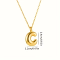 Macro shot of gold bubble letter C pendant showing dimensions of 1.4cm by 1.2cm - Letter C