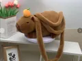 Cute brown capybara plush crossbody bag with orange fruit detail and fuzzy strap - Prone Capybara with Orange / 30cm