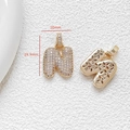 Detailed view of gold letter N pendant with white zircon pavé and 29.9mm size markings - Letter N
