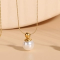 Elegante collar de titanio dorado con colgante de perla blanca y cadena minimalista - Chapado en Oro 18K