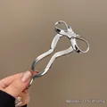 Épingle à cheveux papillon argentée aux courbes élégantes, finition métal, 11,5 cm - Style Noeud Lisse (#218) / Environ 11.5CM / Argent