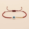 Bracciale intrecciato rosso regolabile con occhio portafortuna e perline dorate - Rosso (MI-B200498U)