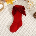 Detail of red baby knit socks with velvet bows on white textured background with autumn decor - Red / Xs 0-1